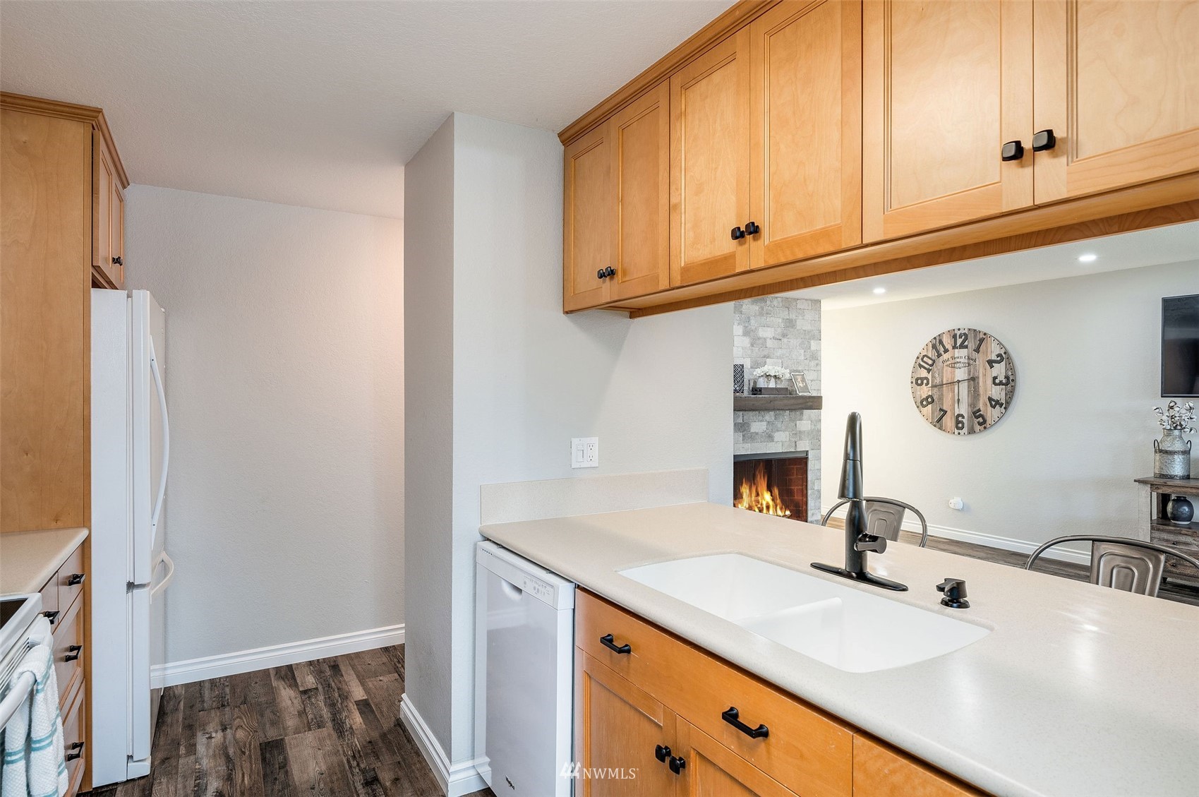 1603 Eagle Ridge Drive South, Unit D4 Renton, WA 98055 - Photo 13 of 30 a kitchen with stainless steel appliances granite countertop a sink and a white cabinets
