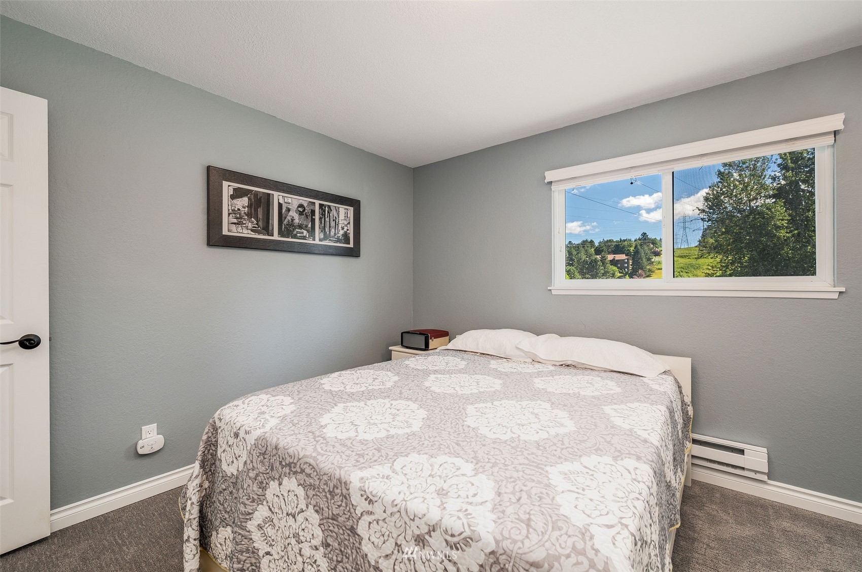 1603 Eagle Ridge Drive South, Unit D4 Renton, WA 98055 - Photo 15 of 30 a bedroom with a bed and a window