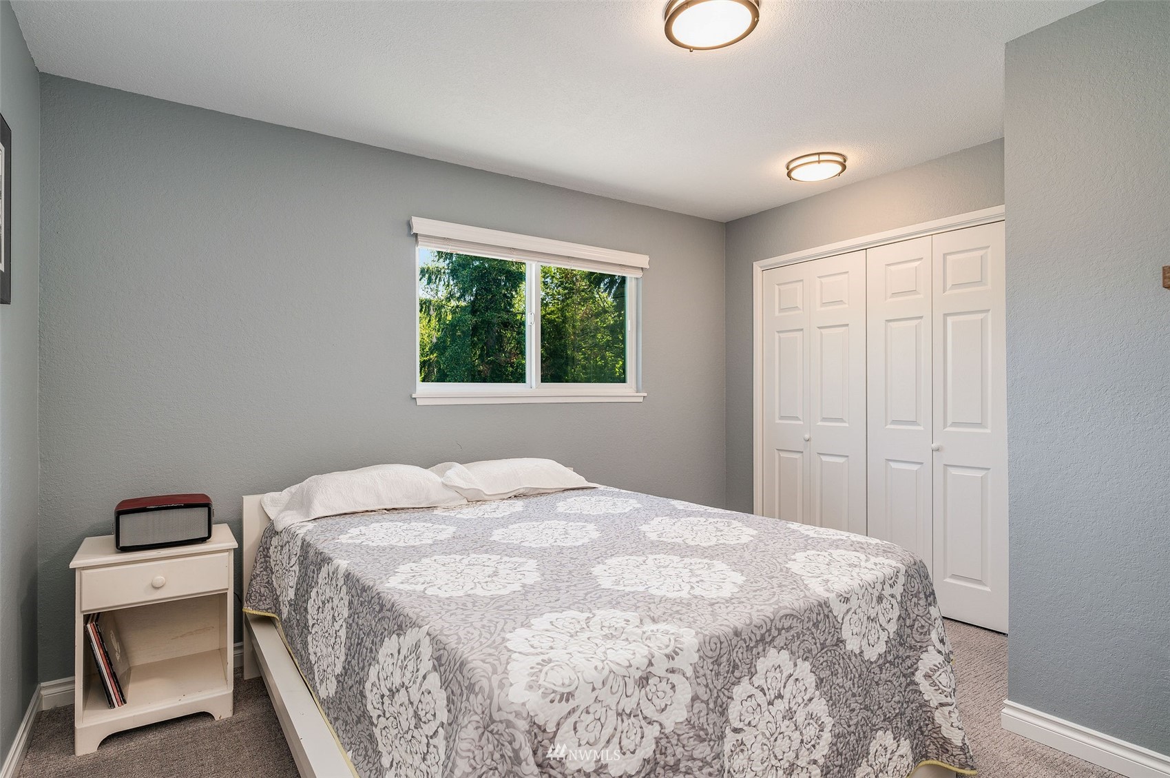 1603 Eagle Ridge Drive South, Unit D4 Renton, WA 98055 - Photo 16 of 30 a bedroom with a bed and a large window
