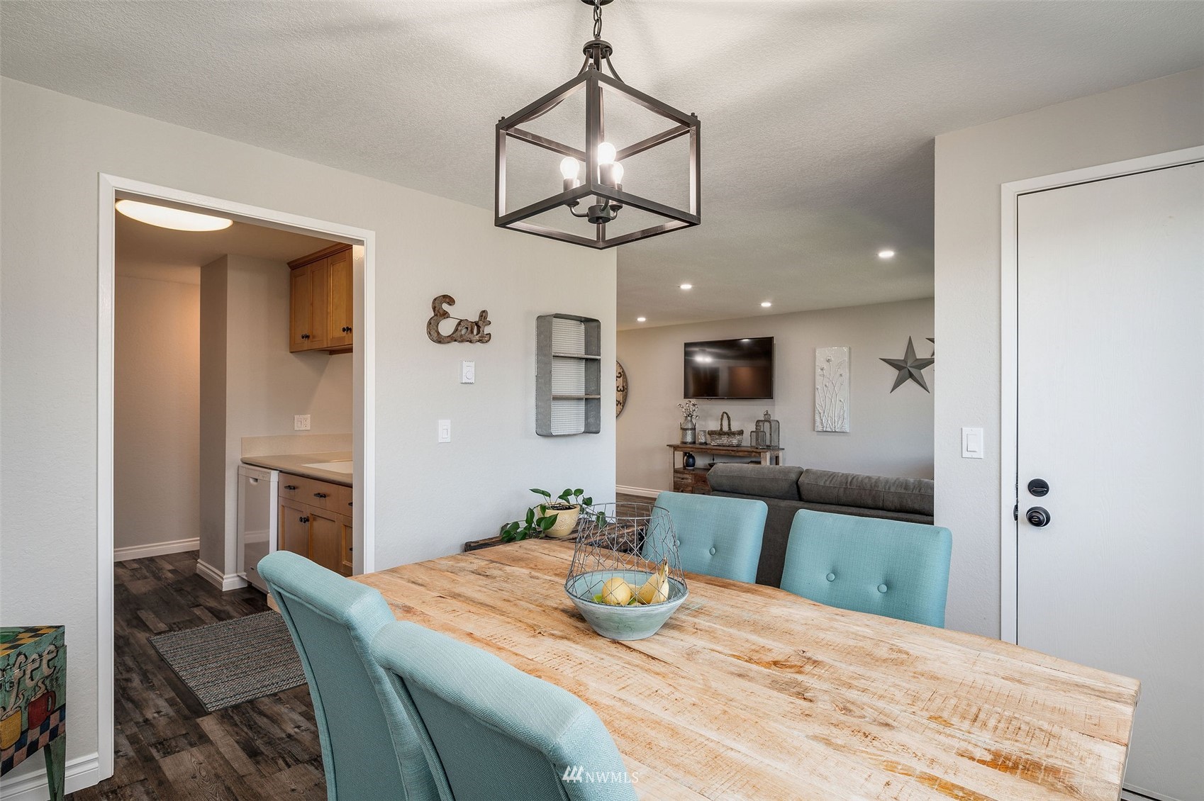 1603 Eagle Ridge Drive South, Unit D4 Renton, WA 98055 - Photo 7 of 30 a bedroom with a bed and a chandelier