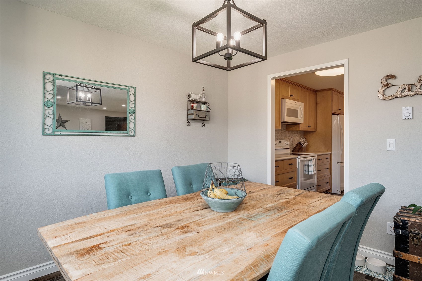 1603 Eagle Ridge Drive South, Unit D4 Renton, WA 98055 - Photo 8 of 30 a bedroom with a bed and chandelier