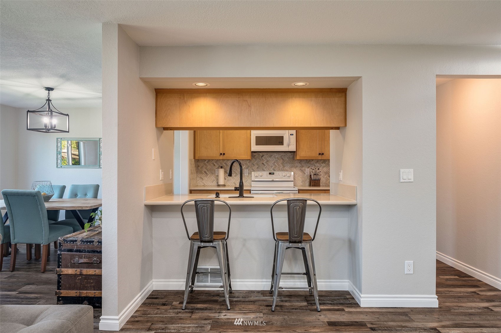 1603 Eagle Ridge Drive South, Unit D4 Renton, WA 98055 - Photo 9 of 30 a view of kitchen with cabinets and wooden floor