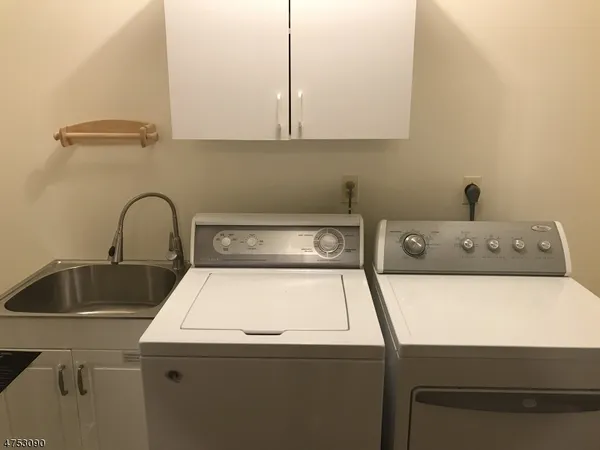 a close view of sink and washing machine