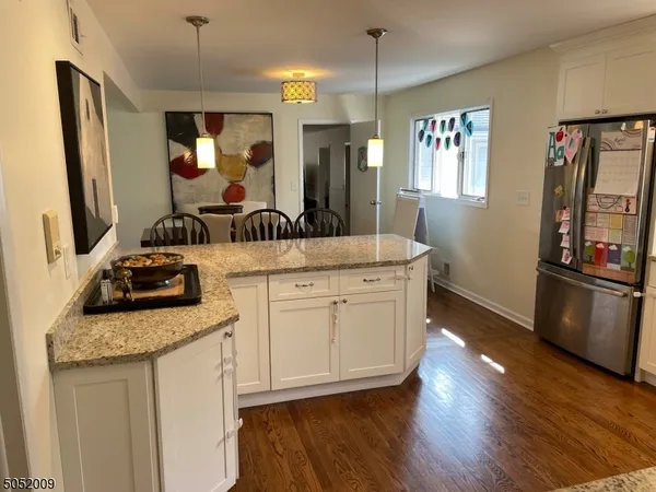 a kitchen with a sink stove and refrigerator