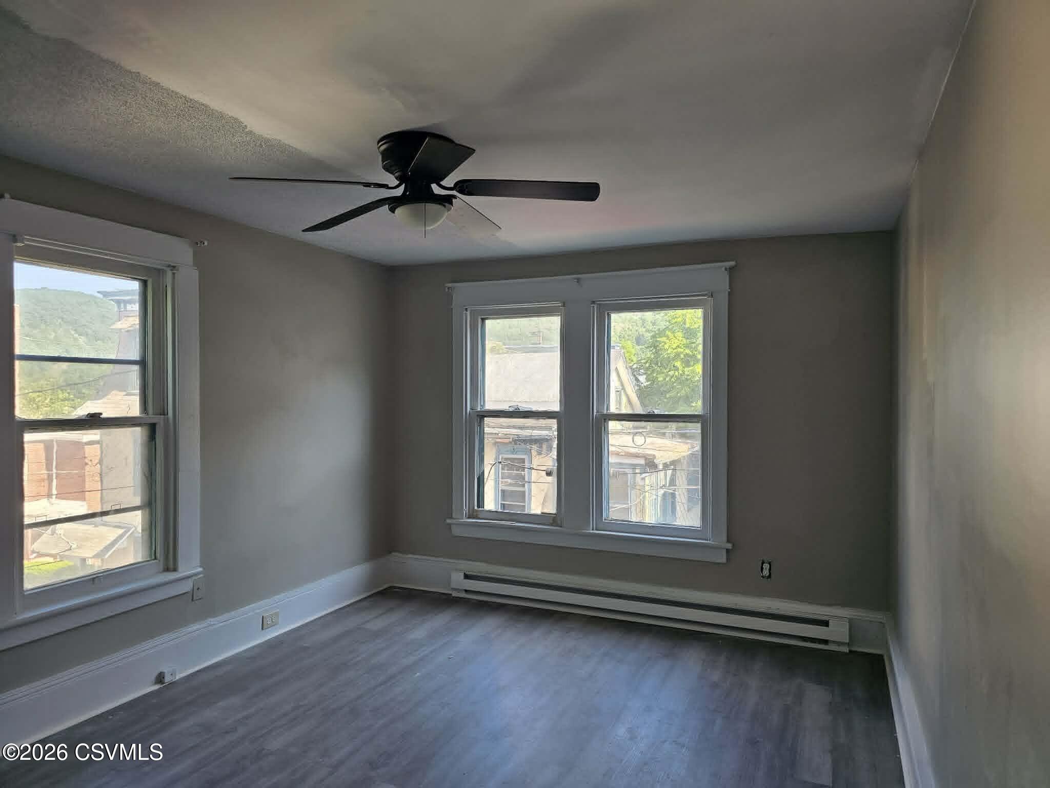 110 Birch Street Shamokin, PA 17872 - Photo 18 of 19 a view of an empty room with a window and wooden floor
