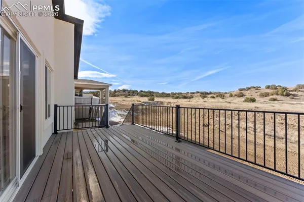 a view of balcony with wooden floor and city view
