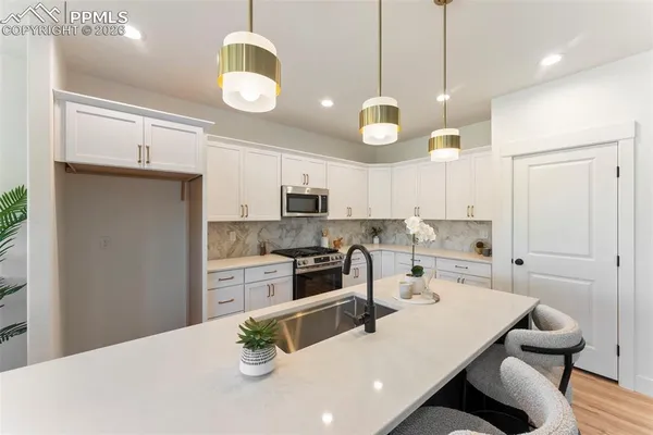 a kitchen with a table and chairs in it