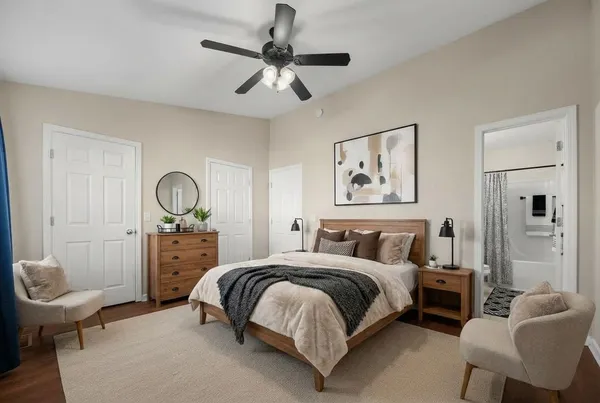 a bedroom with a bed and a chandelier