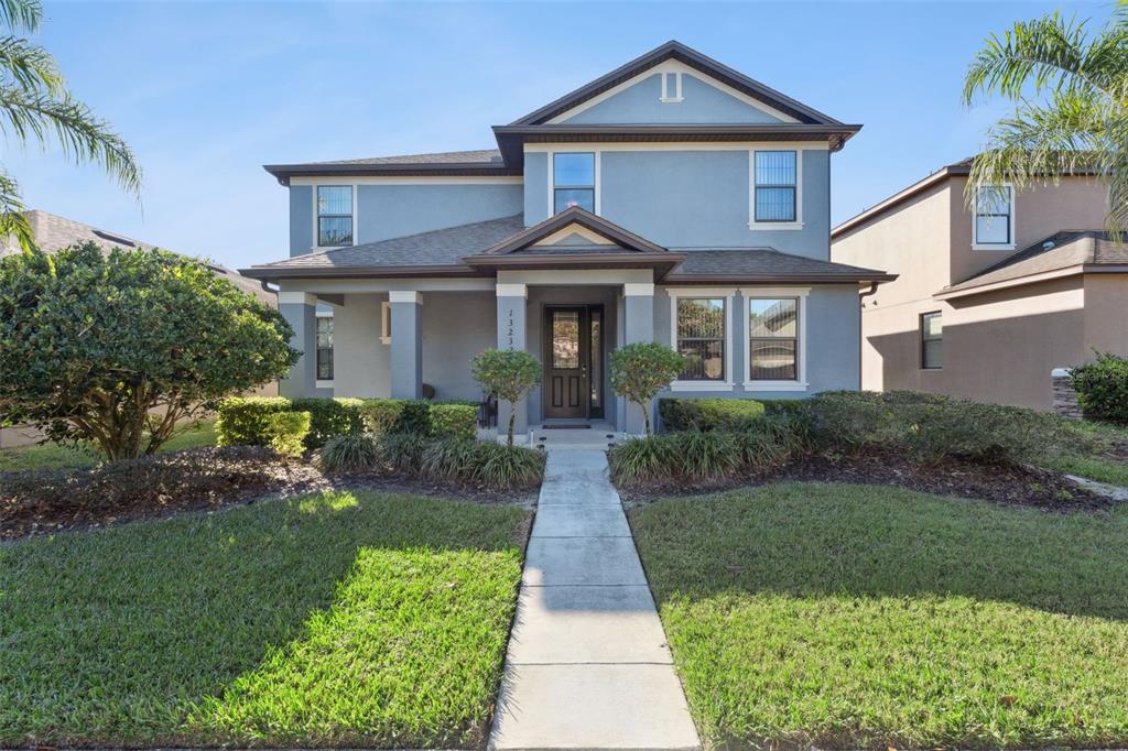 a front view of a house with a yard