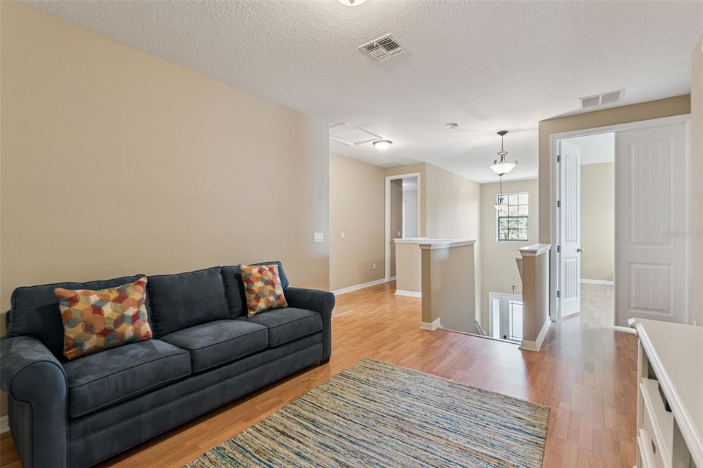 13232 Longacre Drive Windermere, FL 34786 - Photo 15 of 28 a living room with furniture and a wooden floor
