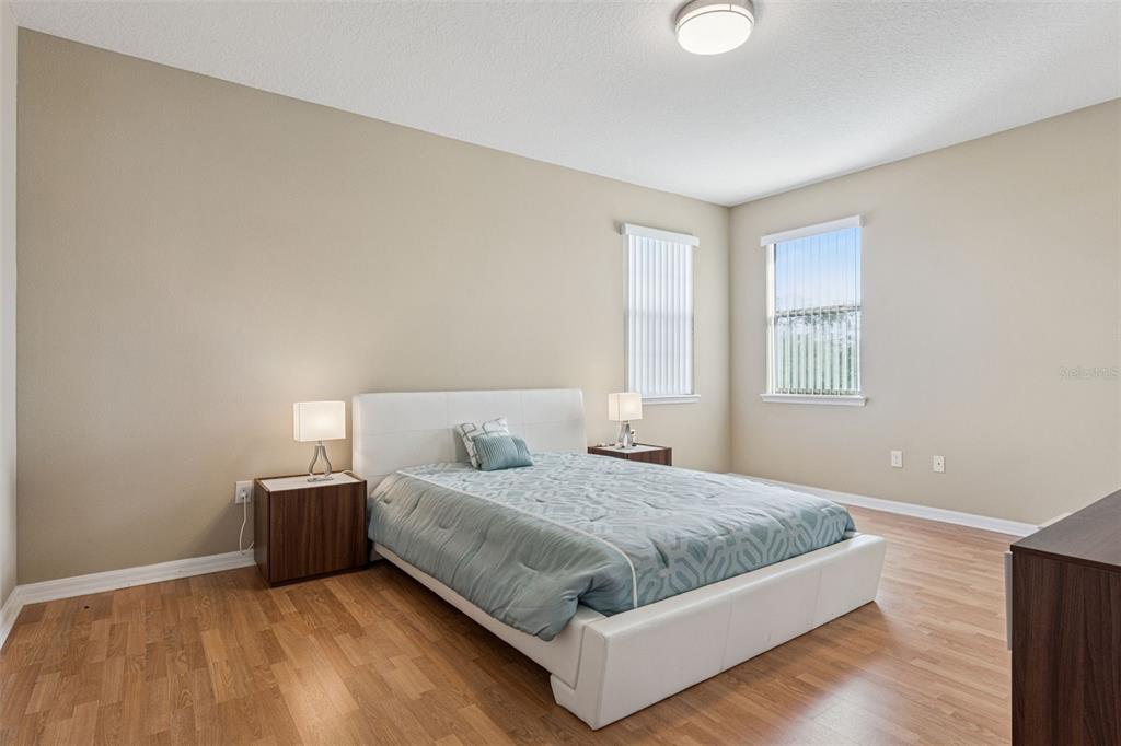 13232 Longacre Drive Windermere, FL 34786 - Photo 16 of 28 a bedroom with a bed and window