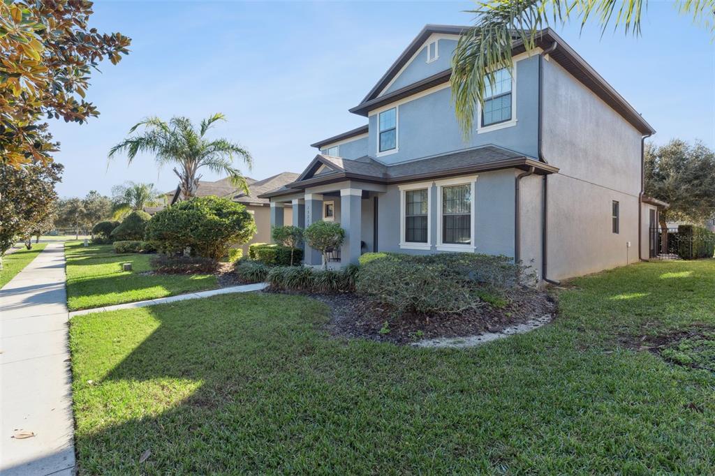 13232 Longacre Drive Windermere, FL 34786 - Photo 2 of 28 a front view of a house with a garden