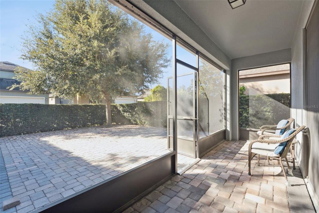 13232 Longacre Drive Windermere, FL 34786 - Photo 21 of 28 a view of a two chair and table in the patio