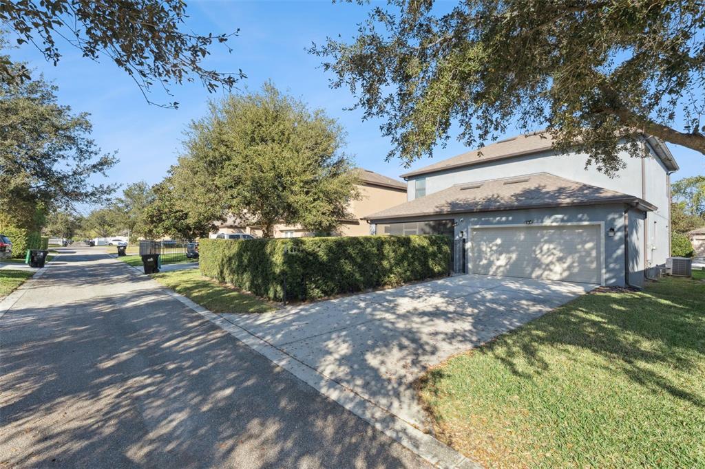 13232 Longacre Drive Windermere, FL 34786 - Photo 25 of 28 a front view of a house with a yard and tree s