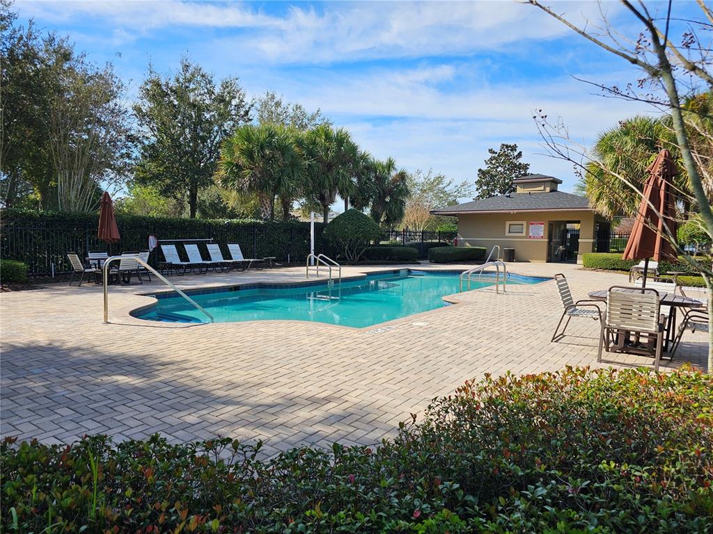 13232 Longacre Drive Windermere, FL 34786 - Photo 29 of 34 a view of a house with swimming pool and sitting area