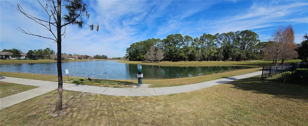 13232 Longacre Drive Windermere, FL 34786 - Photo 33 of 34 a view of a lake with a yard
