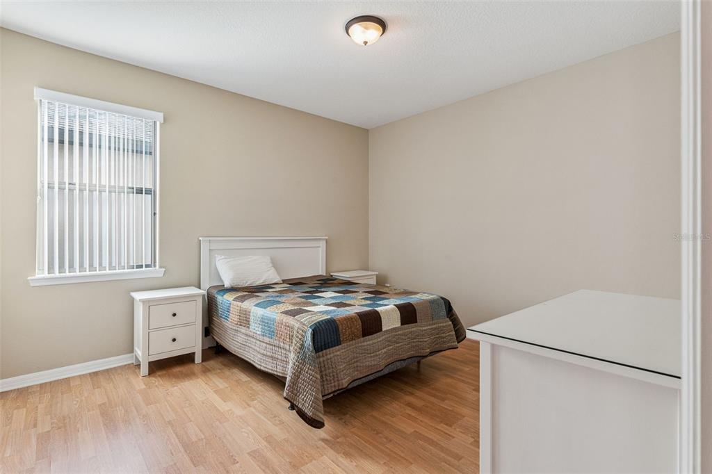 13232 Longacre Drive Windermere, FL 34786 - Photo 8 of 28 a bedroom with a bed and a window