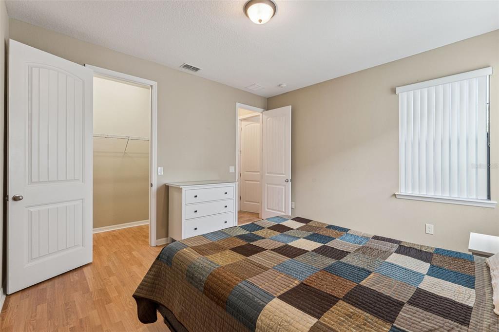 13232 Longacre Drive Windermere, FL 34786 - Photo 9 of 28 a bedroom with a bed and a dresser