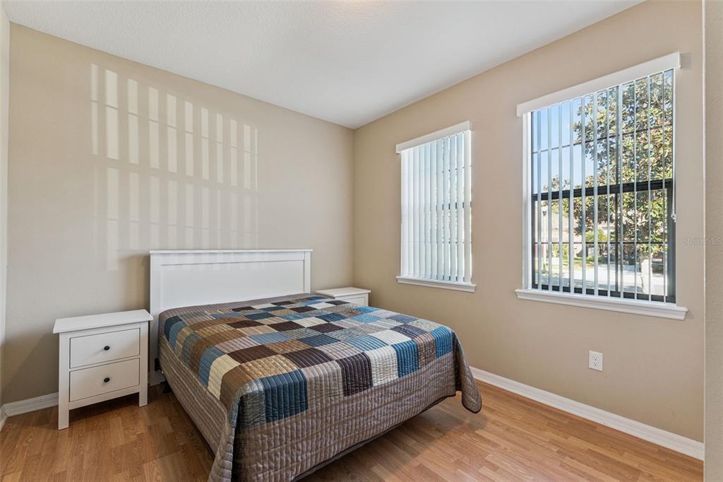 13232 Longacre Drive Windermere, FL 34786 - Photo 10 of 28 a bedroom with a bed and a window