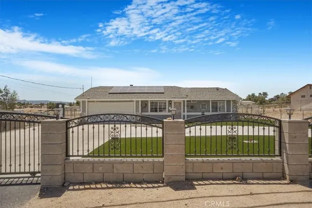 a view of a brick building next to a yard