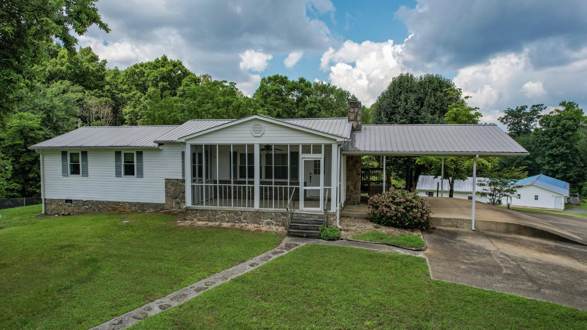 428 Caldwell Road Southeast Cleveland, TN 37323 - Photo 84 of 91 a front view of a house with a garden and porch