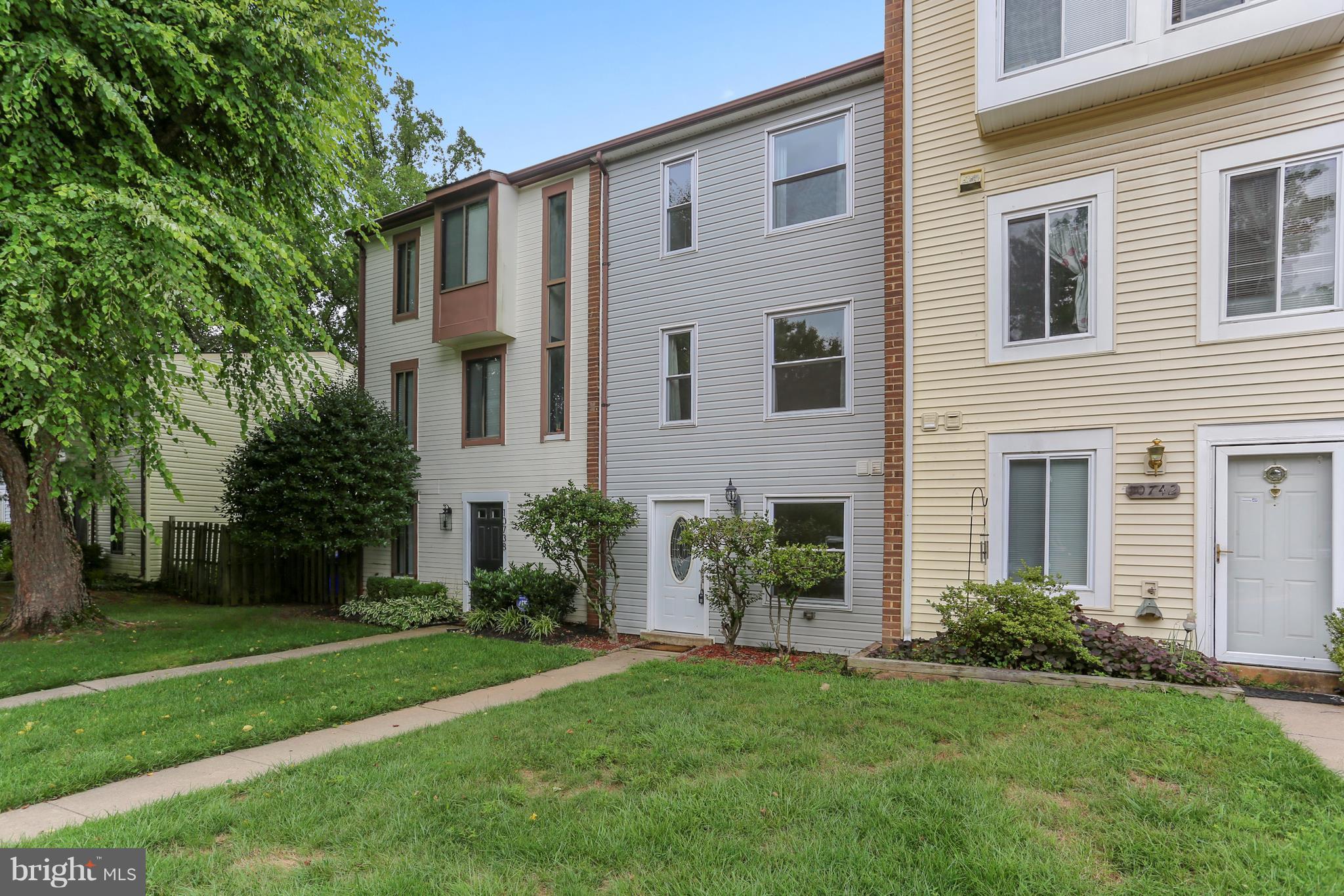 10740 Lester Street Silver Spring, MD 20902 - Photo 2 of 30 a front view of a house with a garden and plants