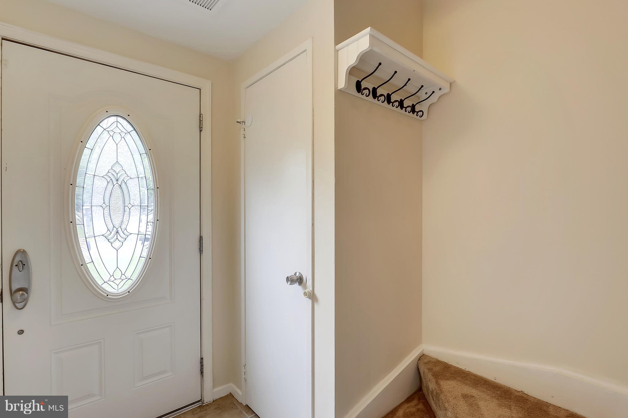 10740 Lester Street Silver Spring, MD 20902 - Photo 12 of 30 a view of front door with wooden floor
