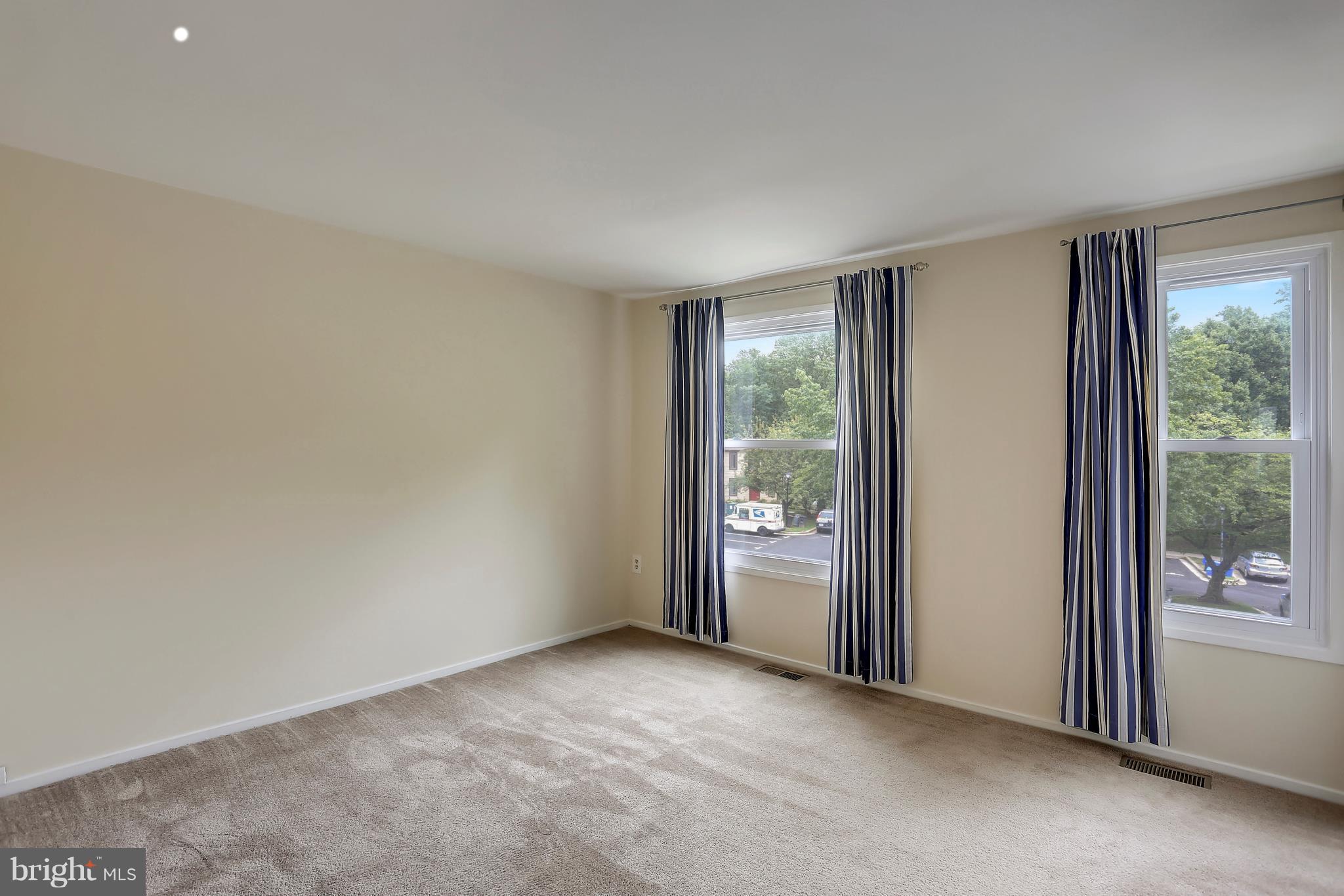 10740 Lester Street Silver Spring, MD 20902 - Photo 19 of 30 an empty room with windows