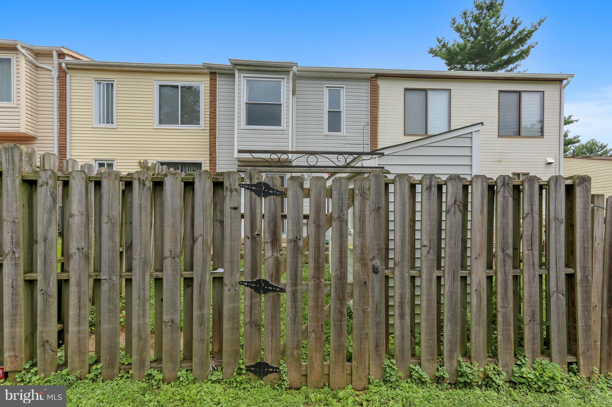 10740 Lester Street Silver Spring, MD 20902 - Photo 26 of 30 a front view of a house with a garden