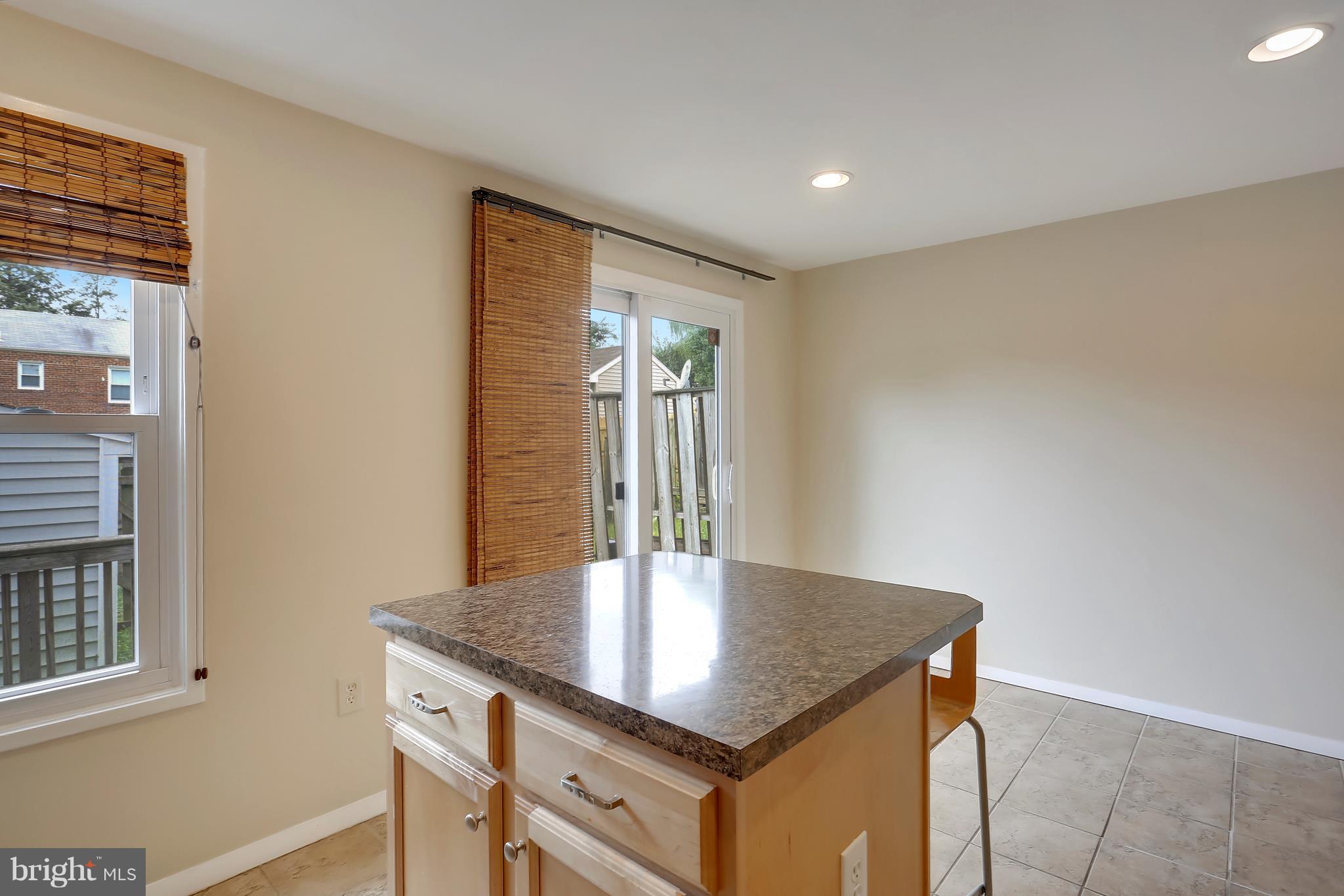 10740 Lester Street Silver Spring, MD 20902 - Photo 7 of 30 a kitchen with a table and window
