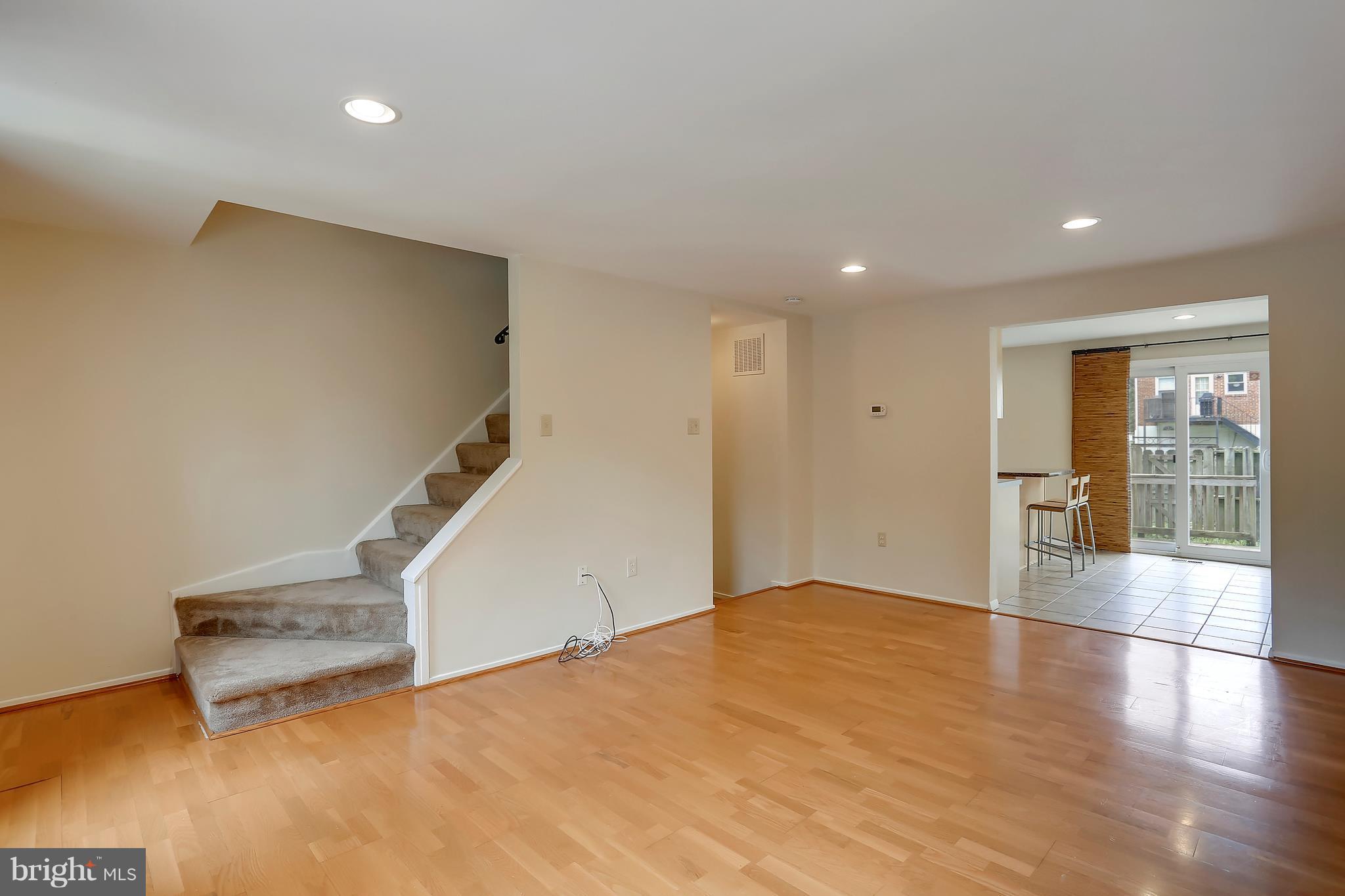 10740 Lester Street Silver Spring, MD 20902 - Photo 10 of 30 a view of an empty room with glass door