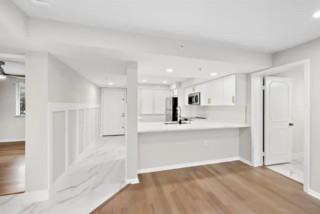 a view of kitchen with wooden floor