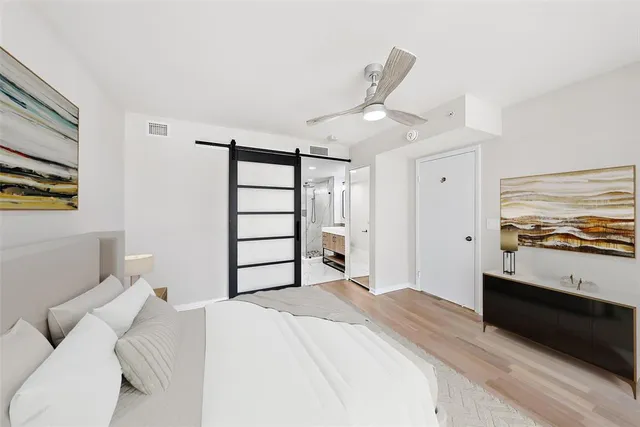 a bedroom with a bed and a view of bathroom