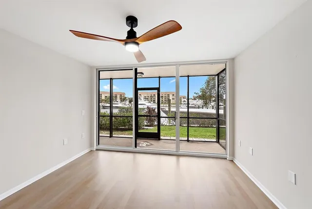 an empty room with ceiling fan