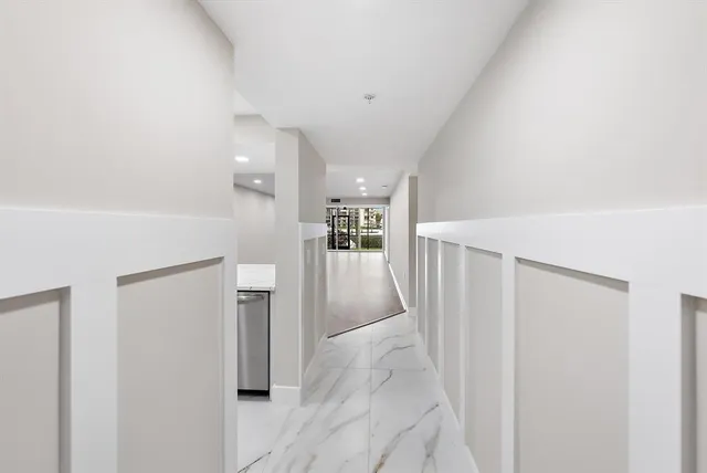 a view of livingroom with furniture and refrigerator
