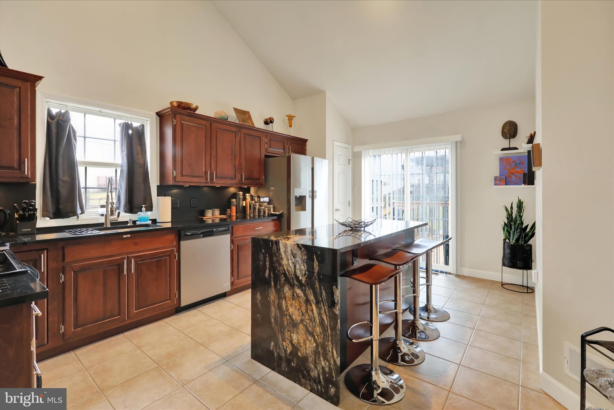 73 Michigan Drive Reading, PA 19608 - Photo 15 of 42 a open kitchen with stainless steel appliances granite countertop a stove top oven a sink and a refrigerator