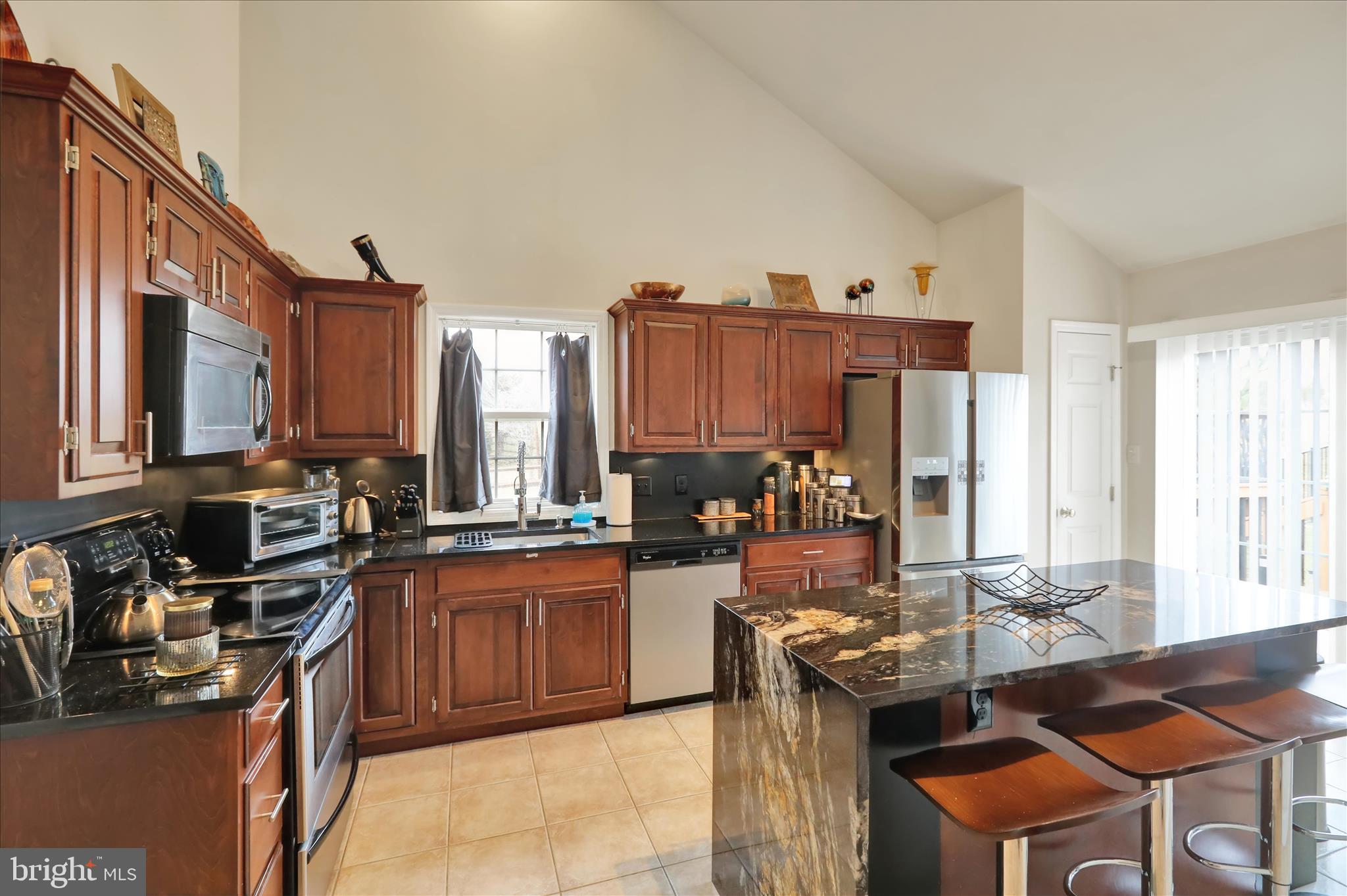 73 Michigan Drive Reading, PA 19608 - Photo 16 of 42 a kitchen with stainless steel appliances granite countertop a sink stove and refrigerator