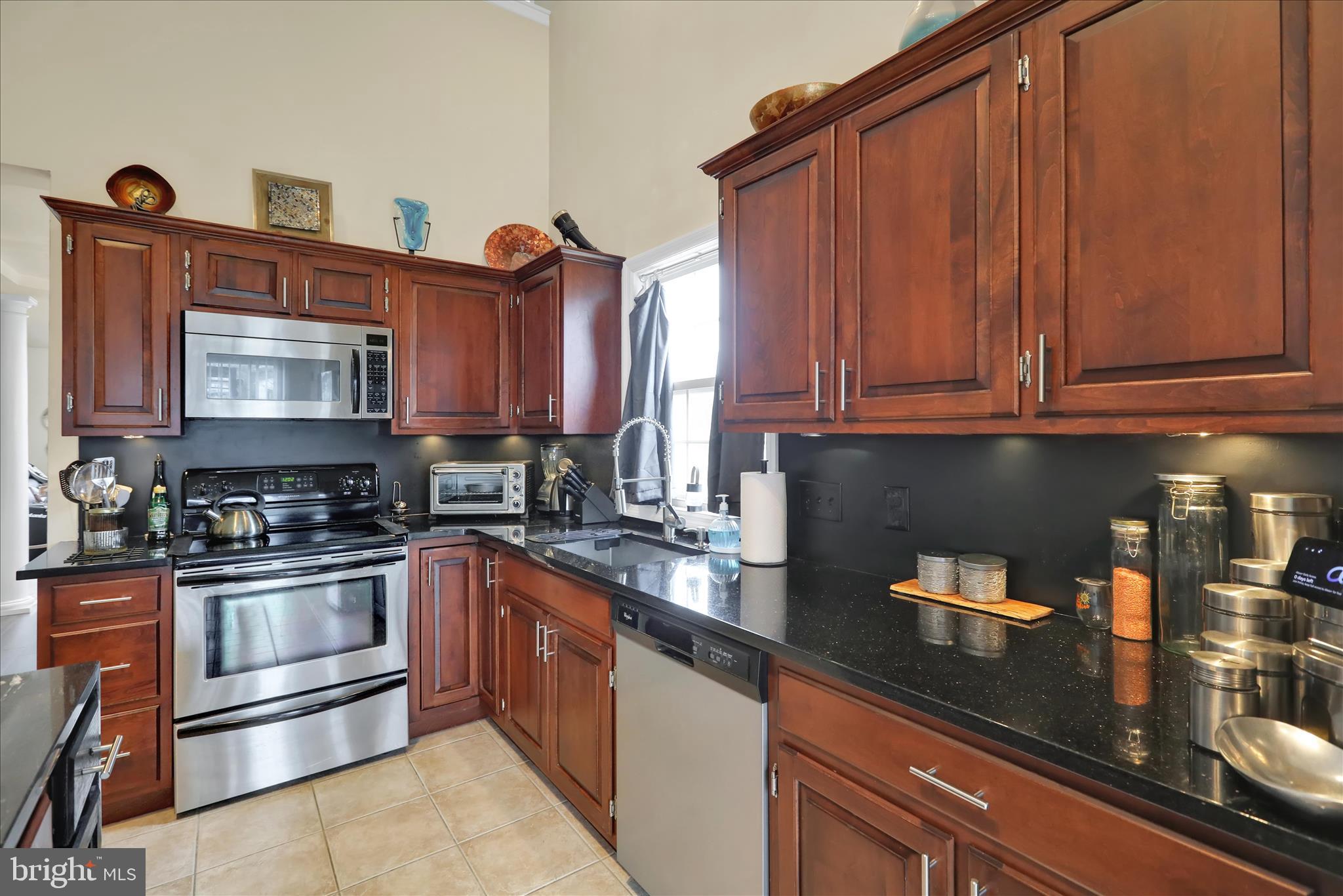 73 Michigan Drive Reading, PA 19608 - Photo 18 of 42 a kitchen with stainless steel appliances granite countertop a sink stove and microwave