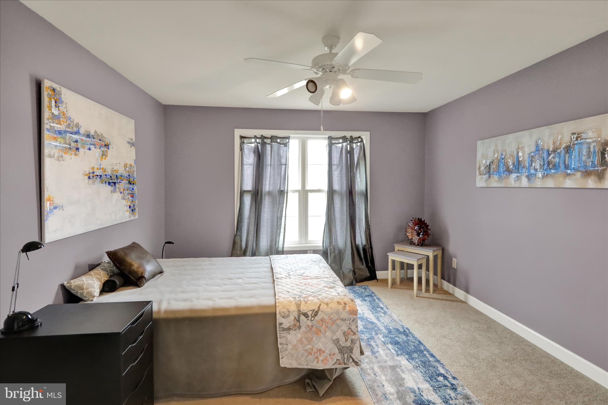 73 Michigan Drive Reading, PA 19608 - Photo 24 of 42 a bedroom with a bed and a chandelier