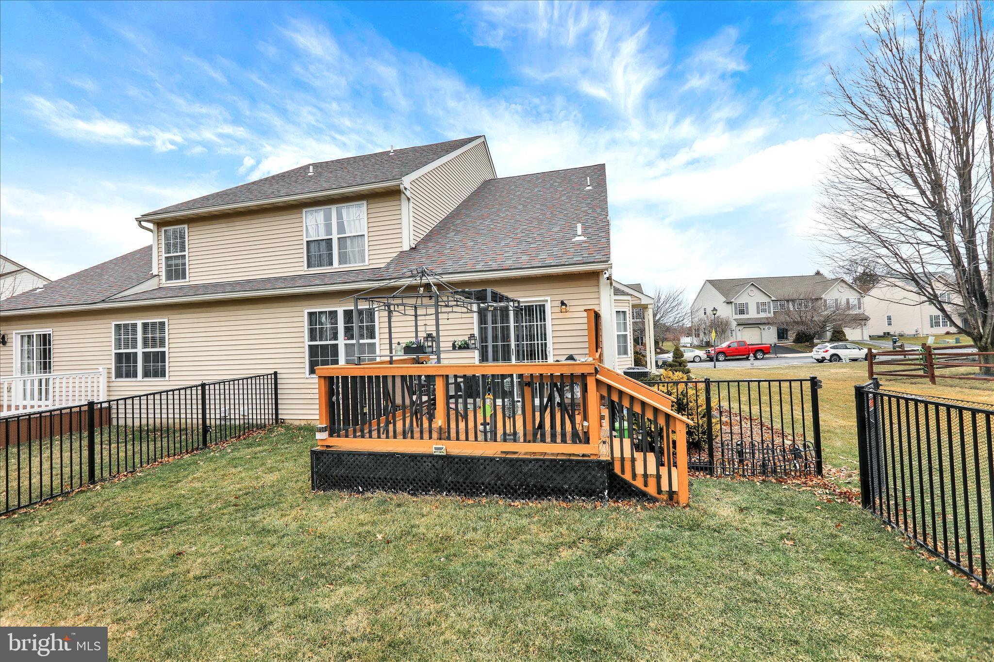 73 Michigan Drive Reading, PA 19608 - Photo 31 of 42 a view of a house with wooden deck and a yard