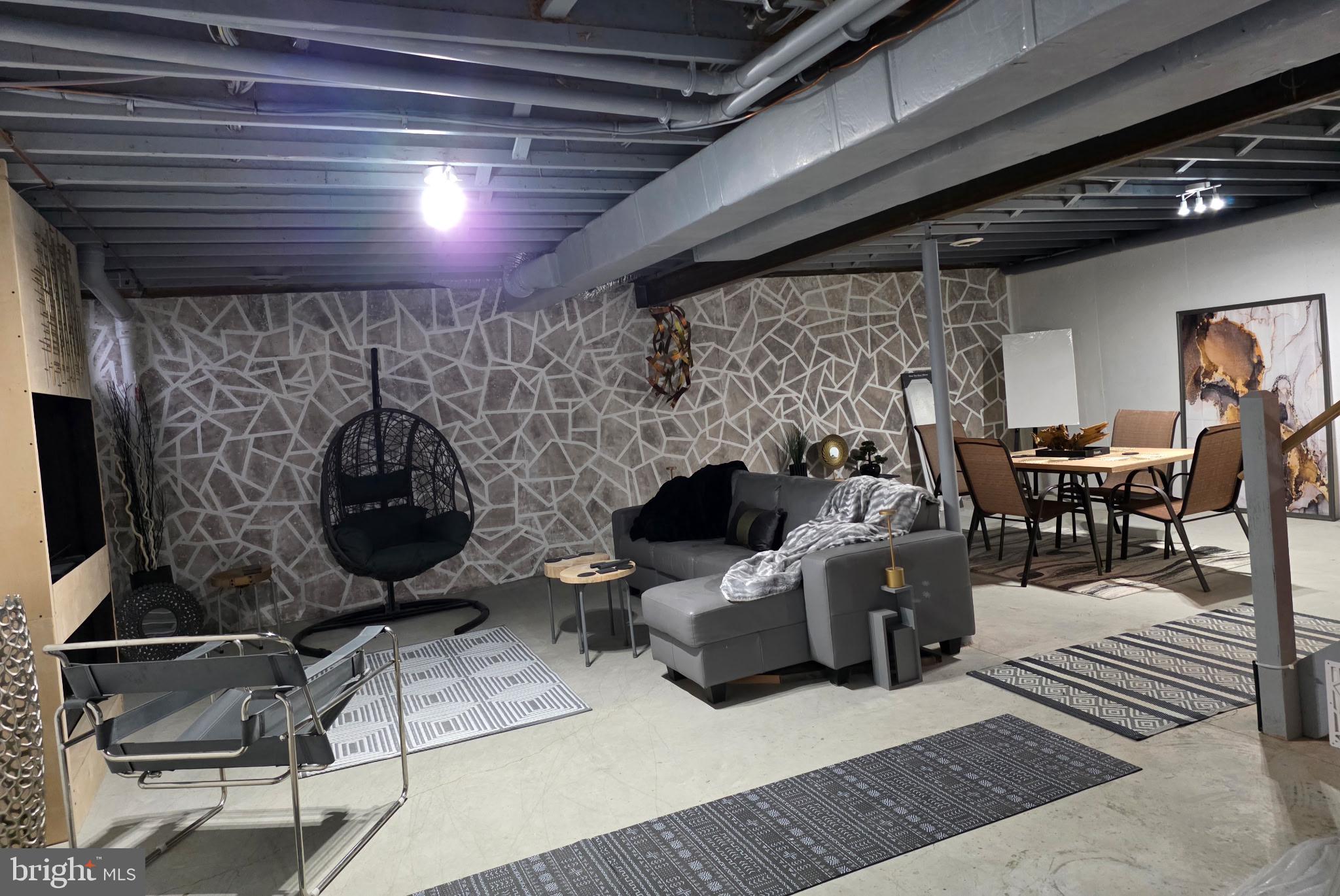 73 Michigan Drive Reading, PA 19608 - Photo 40 of 42 a living room with furniture a flat screen tv and a fireplace