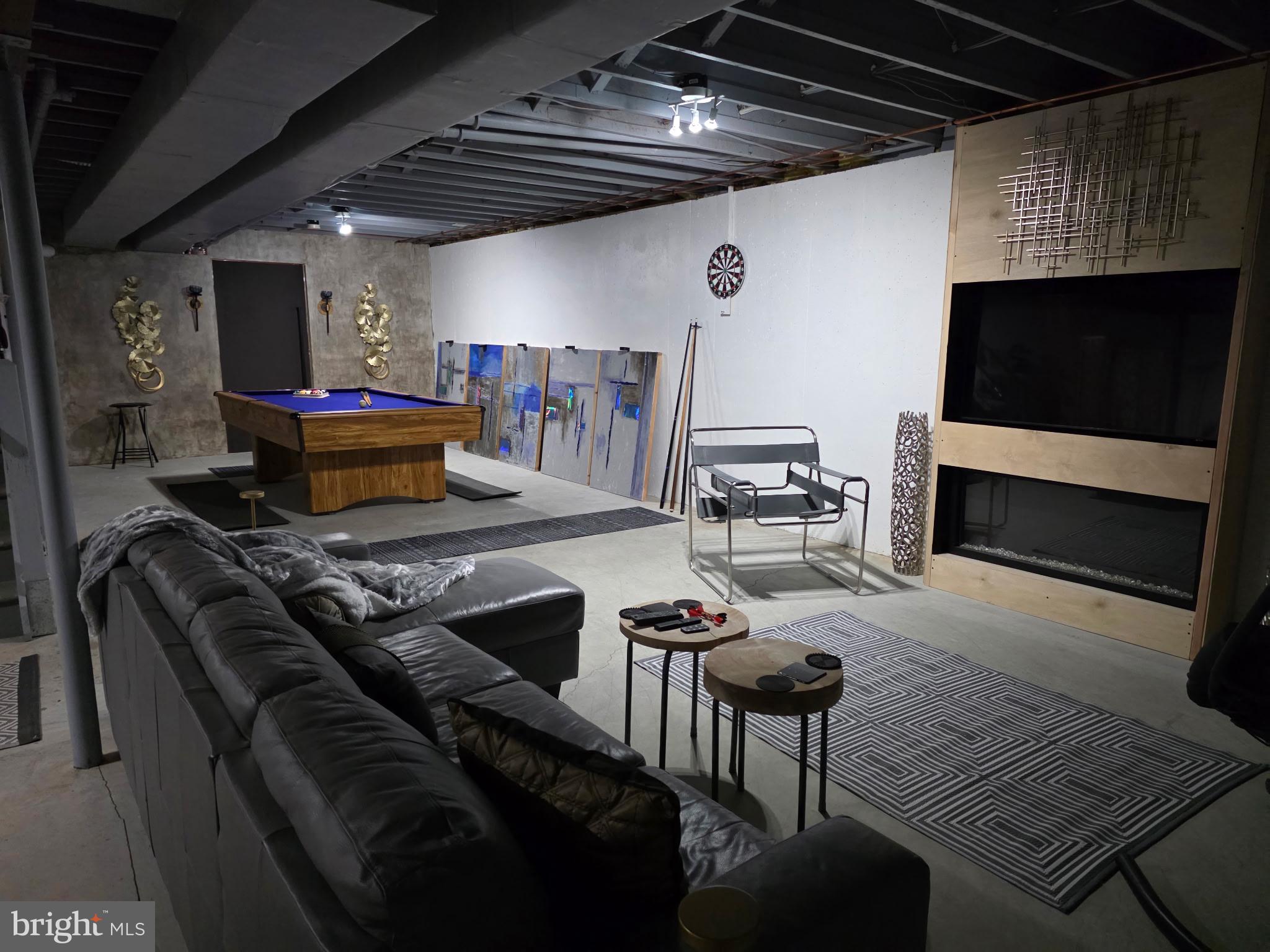 73 Michigan Drive Reading, PA 19608 - Photo 42 of 42 a living room with furniture and a flat screen tv