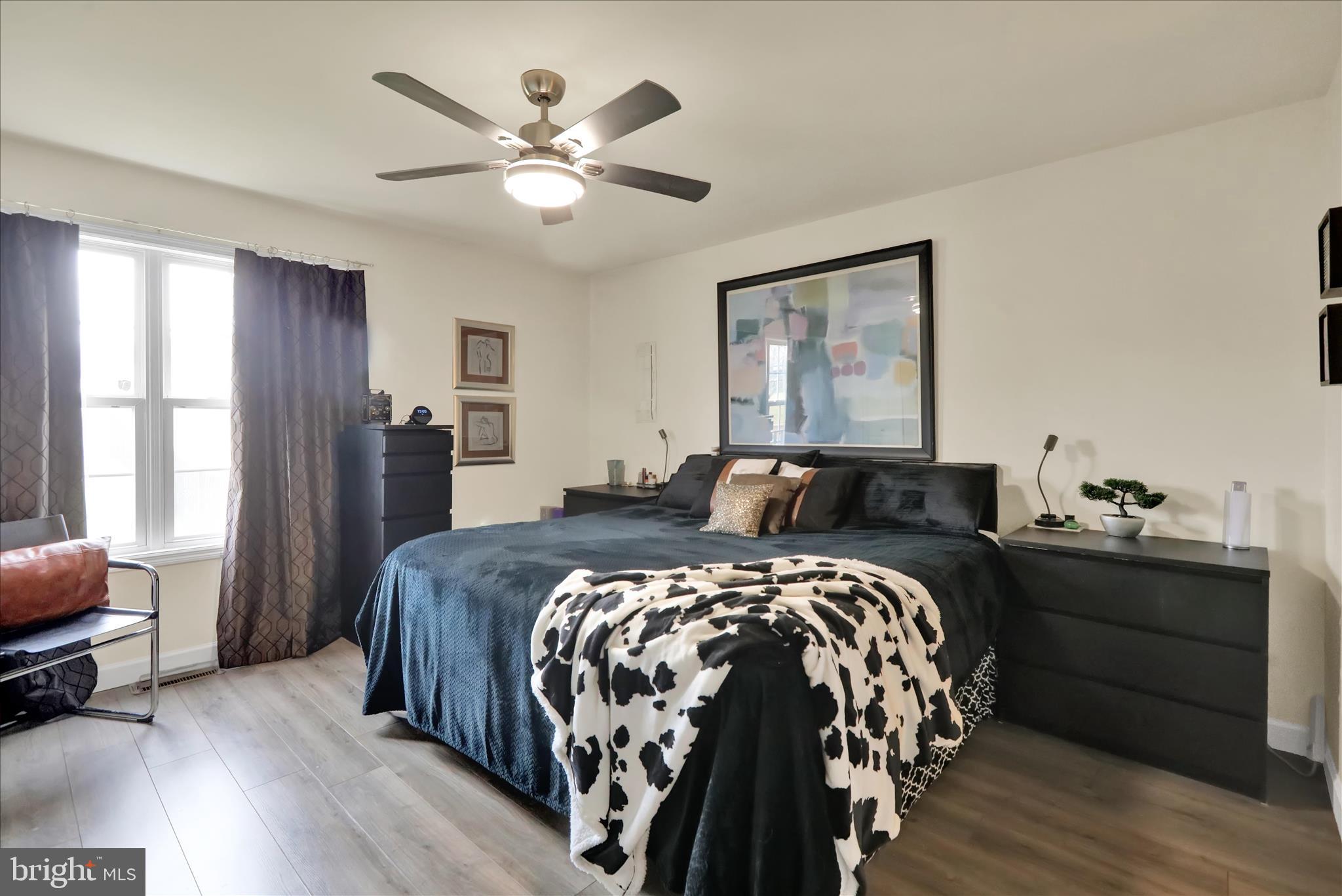 73 Michigan Drive Reading, PA 19608 - Photo 8 of 42 a bed room with a bed and a chandelier