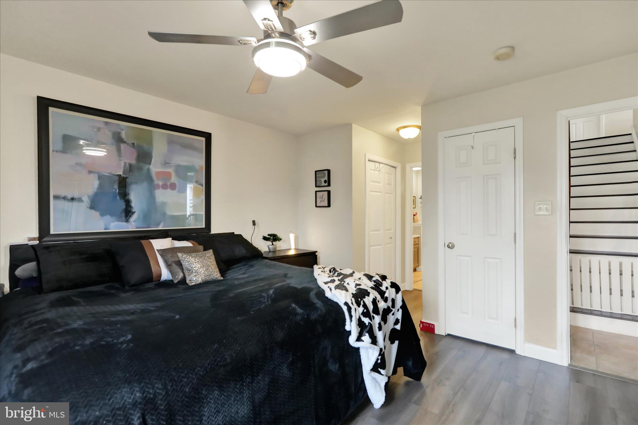 73 Michigan Drive Reading, PA 19608 - Photo 9 of 42 a bedroom with a bed and wooden floor