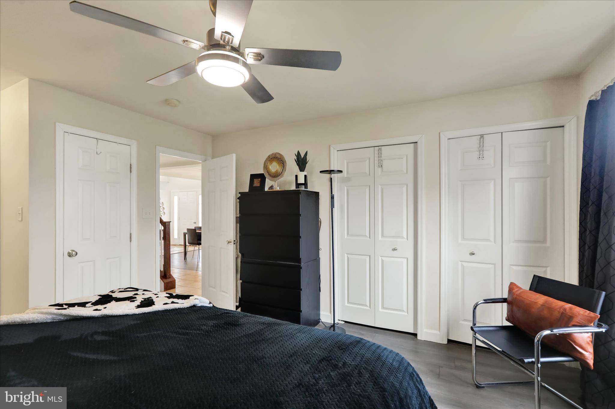 73 Michigan Drive Reading, PA 19608 - Photo 10 of 42 a bedroom with a bed and a chandelier