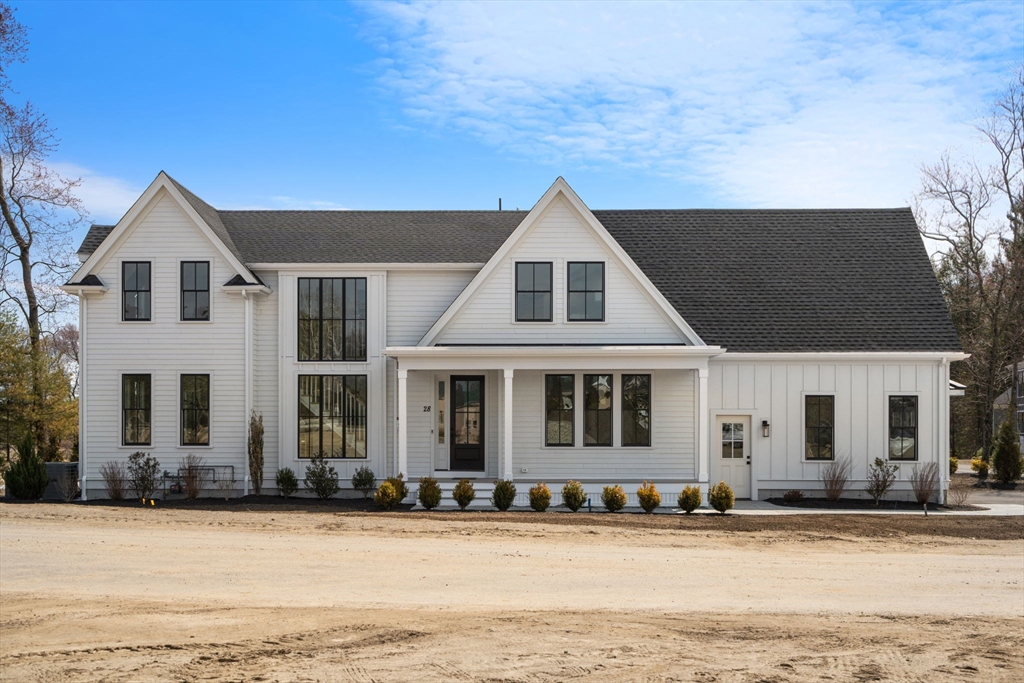 1060 Grove Street, Unit LOT 23 Framingham, MA 01701 - Photo 1 of 15 a front view of a house with a yard