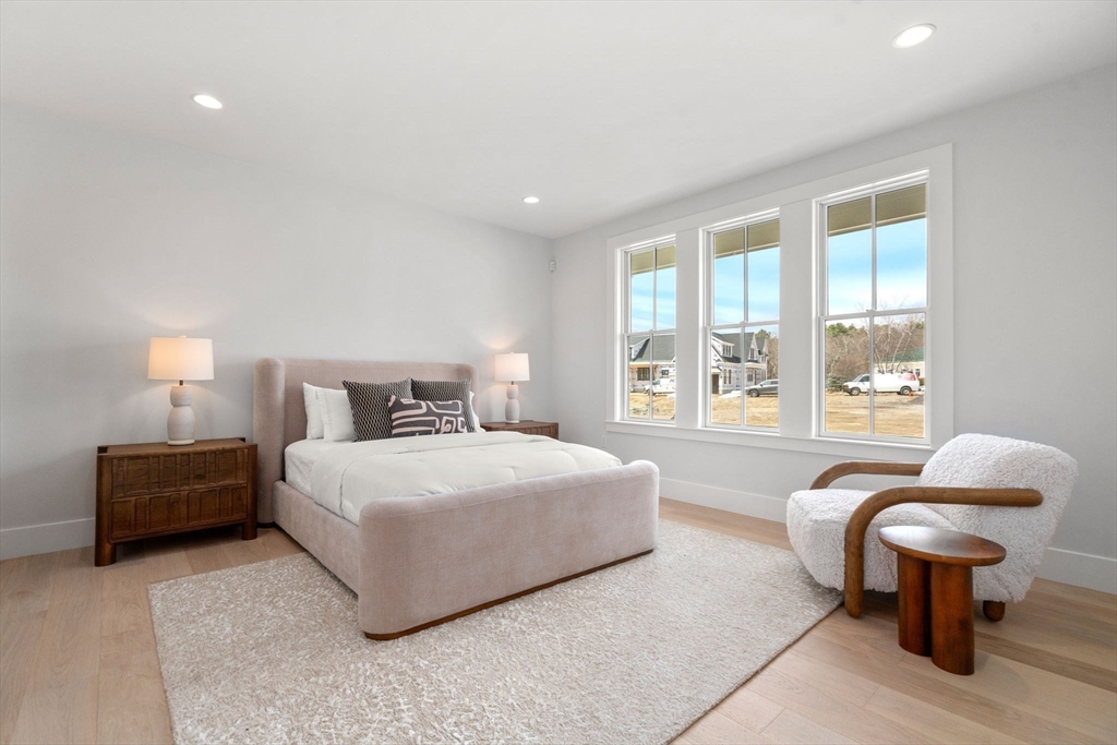 1060 Grove Street, Unit LOT 23 Framingham, MA 01701 - Photo 11 of 15 a bedroom with a bed and a couch