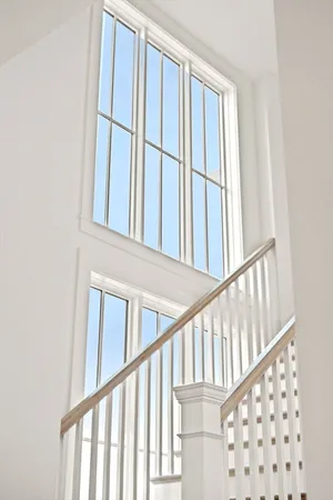 a view of staircase with railing and a stairs