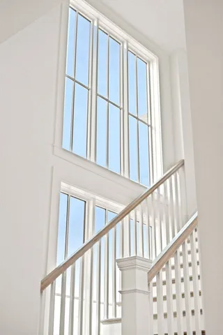 a view of staircase with railing and a stairs