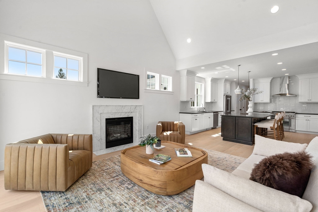 1060 Grove Street, Unit LOT 23 Framingham, MA 01701 - Photo 6 of 15 a living room with furniture and a fireplace
